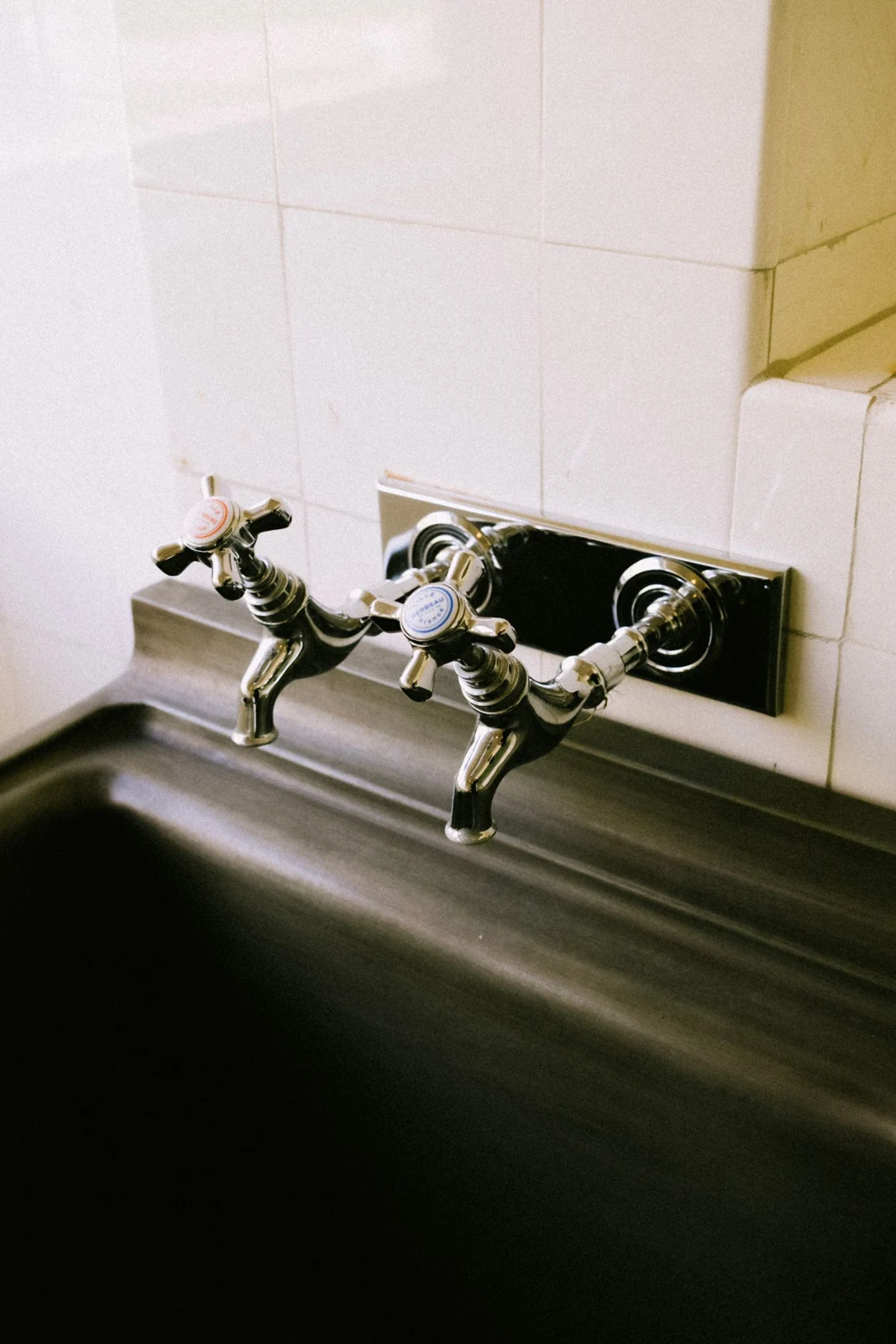 Traditional wall-mounted bath taps