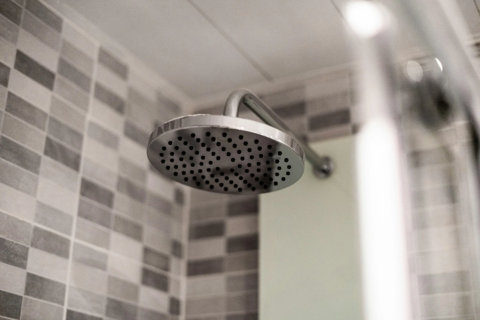 Shower head and patterned tiles