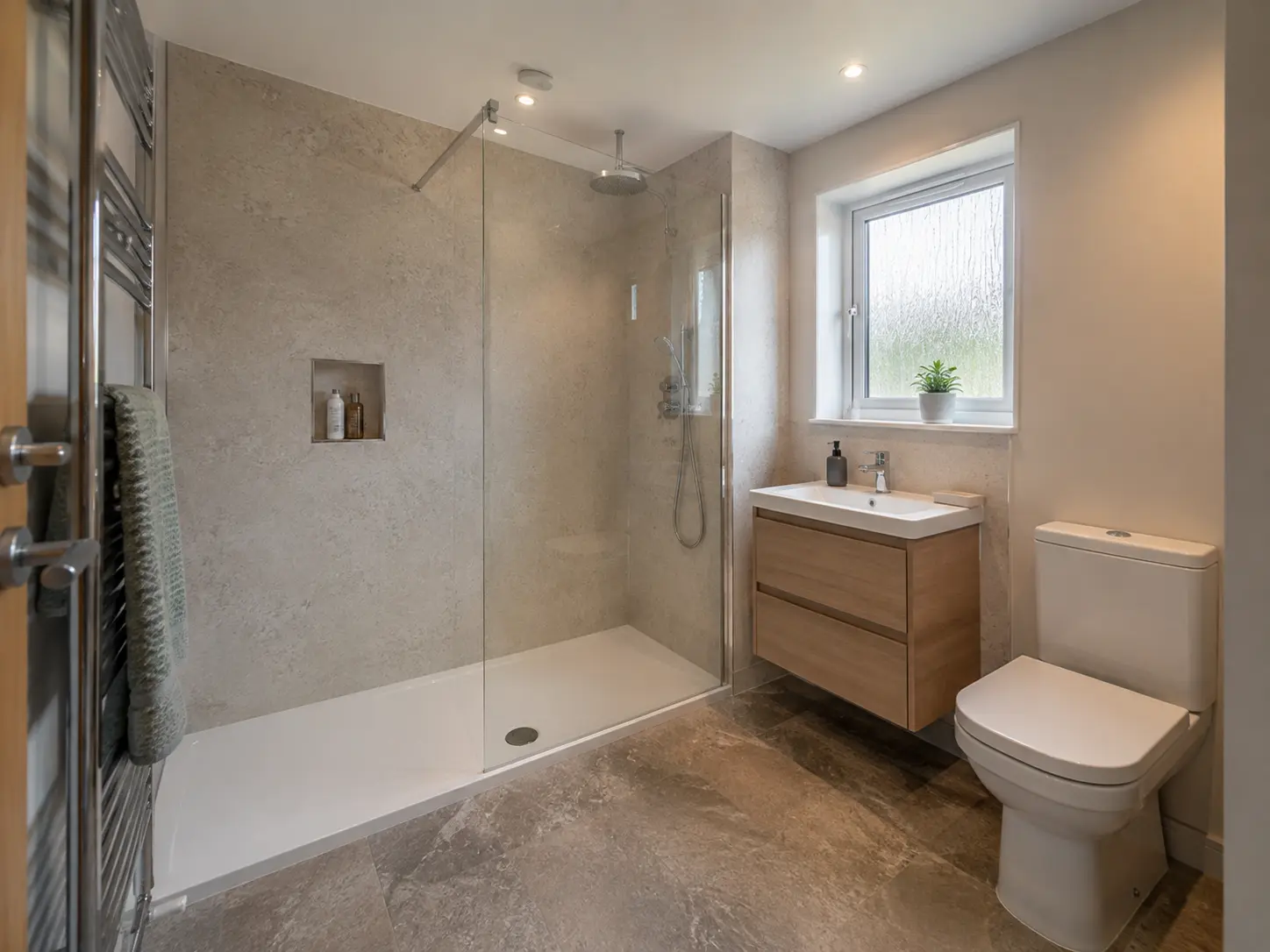 Walk-in shower room with low tray and frameless screen